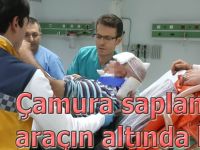 Çamura saplanan aracın altında kaldı