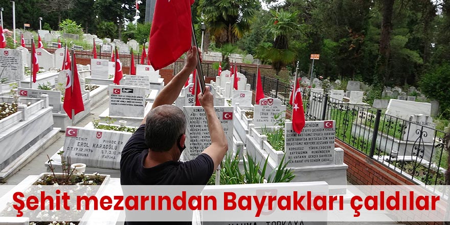 Şehit mezarından Bayrakları çaldılar