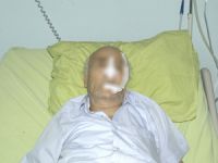 Eşini bastonla yaraladı