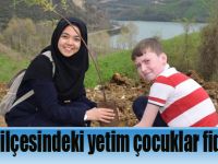 Ayvacık ilçesindeki yetim çocuklar fidan dikti