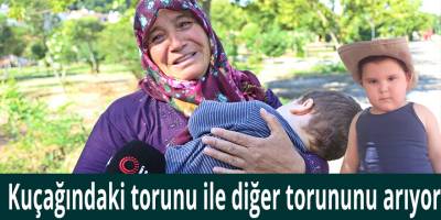 Kuçağındaki torunu ile diğer torununu arıyor