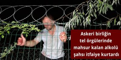 Askeri birliğin tel örgülerinde mahsur kalan alkolü şahsı itfaiye kurtardı