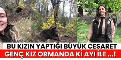 Orman muhafaza memuru genç kadın ayı ile özçekim yaptı