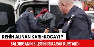 Rehin alınan karı-kocayı saldırganın bileğini ısırarak kurtardı
