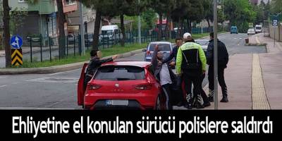 Ehliyetine el konulan sürücü polislere saldırdı