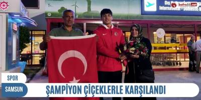 Şampiyon çiçeklerle karşılandı