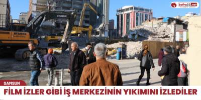 Film izler gibi iş merkezinin yıkımını izlediler