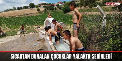 Sıcaktan bunalan çocuklar yalakta serinledi